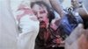 Graphic photo purportedly showing an injured Gaddafi, taken on a mobile phone.jpg