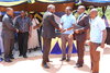 Kigoma Regional Commissioner,  Lt Colonel(Retired) Hon. Issa Machibya shaking hands with WLF's P.JPG