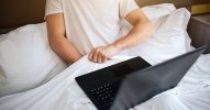 1_Young-man-sit-in-bed-early-morning-He-hold-hand-under-white-blanket-and-masturbating-Laptop-...jpg