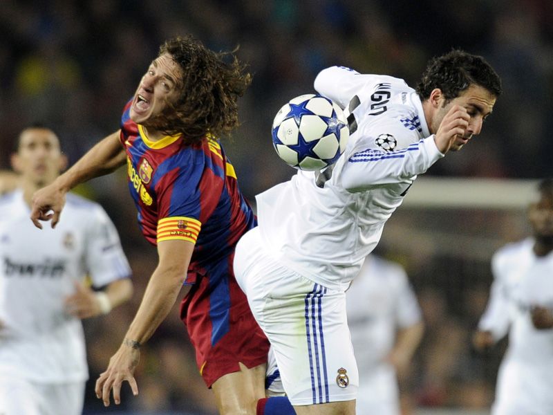 Barcelona-v-Real-Madrid-puyol-gonzalo-higuain_2592584.jpg