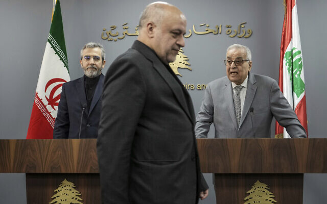 Iranian Ambassador to Lebanon, Mojtaba Amani, center, walks in front of Iranian interim Foreign Minister Ali Bagheri Kani, left, and Lebanese Foreign Minister Abdallah Bouhabib, during a news conference in Beirut, Lebanon, June 3, 2024 (AP Photo/Hassan Ammar) Iranian Ambassador to Lebanon, Mojtaba Amani, center, walks in front of Iranian interim Foreign Minister Ali Bagheri Kani, left, and Lebanese Foreign Minister Abdallah Bouhabib, during a news conference in Beirut, Lebanon, June 3, 2024 (AP Photo/Hassan Ammar)