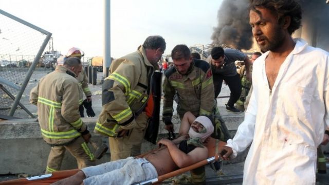 An injured man is evacuated from the scene