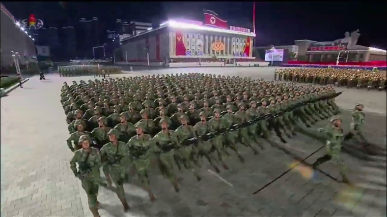 A screen grab taken from a KCNA broadcast on October 10, 2020 shows North Korean soldiers marching during a military parade on Kim Il Sung square in Pyongyang. - Nuclear-armed North Korea held a giant military parade, television images showed, with thousands of maskless troops defying the coronavirus threat and Pyongyang expected to put on show its latest and most advanced weapons. (Photo by - / KCNA VIA KNS / AFP) / - South Korea OUT / REPUBLIC OF KOREA OUT ---EDITORS NOTE--- RESTRICTED TO EDITORIAL USE - MANDATORY CREDIT AFP PHOTO/KCNA - NO MARKETING NO ADVERTISING CAMPAIGNS - DISTRIBUTED AS A SERVICE TO CLIENTS THIS PICTURE WAS MADE AVAILABLE BY A THIRD PARTY. AFP CAN NOT INDEPENDENTLY VERIFY THE AUTHENTICITY, LOCATION, DATE AND CONTENT OF THIS IMAGE. / (Photo by -/KCNA VIA KNS/AFP via Getty Images)