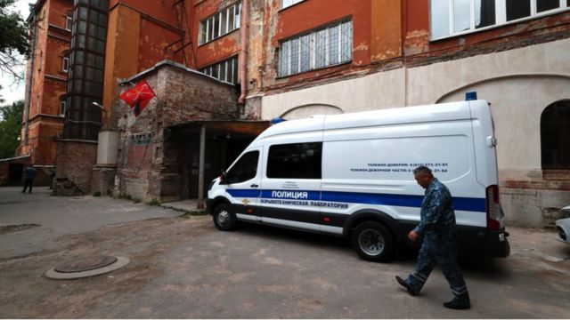 Police van and police officer in Russia