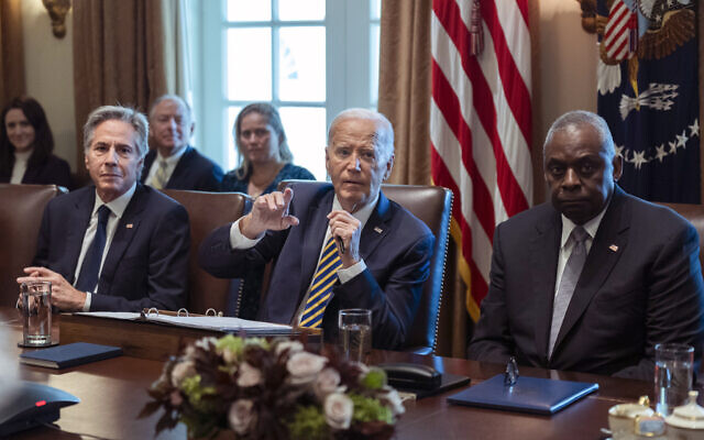 US President Joe Biden flanked Secretary of State Antony Blinken, left, and Secretary of Defense Lloyd Austin, right, speaks during a meeting with the members of his cabinet in the Cabinet Room of the White House, September 20, 2024. (Manuel Balce Ceneta/AP)
