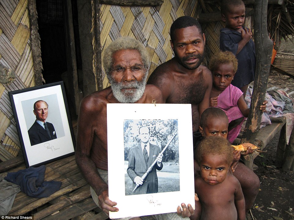 Through an interpreter village chief Jack Malia (pictured left) said: 'If he comes one day the people will not be poor, there will be no sickness, no debt and the garden will be growing very well.