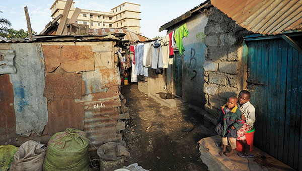 Tanzania-children-outside-small-home.jpg