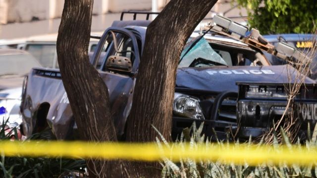 Wreckage of police vehicles at the scene of the blast