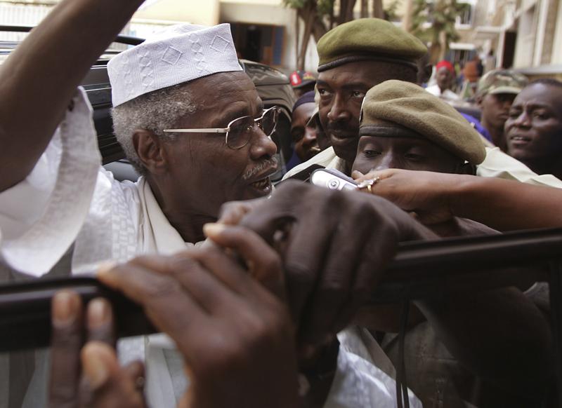 FILE - In this Friday, Nov. 25, 2005 file photo, former Chad dictator Hissene Habre gestures as he leaves a court in Dakar, Senegal. Chad's former dictator Hissene Habre, whose government was accused of killing tens of thousands and became the first former head of state to be convicted of crimes against humanity by an African court, has died in Senegal of COVID-19, aged 79, according to Senegalese officials Tuesday, Aug. 24, 2021. (AP Photo/Schalk van Zuydam, File) FILE - In this Friday, Nov. 25, 2005 file photo, former Chad dictator Hissene Habre gestures as he leaves a court in Dakar, Senegal. Chad's former dictator Hissene Habre, whose government was accused of killing tens of thousands and became the first former head of state to be convicted of crimes against humanity by an African court, has died in Senegal of COVID-19, aged 79, according to Senegalese officials Tuesday, Aug. 24, 2021. (AP Photo/Schalk van Zuydam, File)